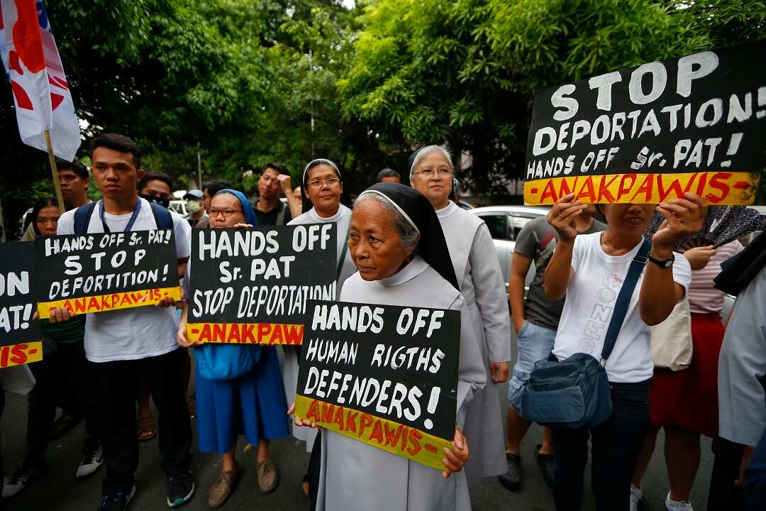 Supporters of Australian Roman Catholic nun Sister Patricia Fox rally outside the Justice Department in Manila, Philippines.