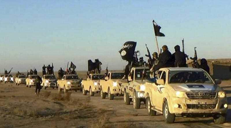 This image, taken at the height of the so-called Islamic State's power in 2014, shows militants on the road to Iraq.