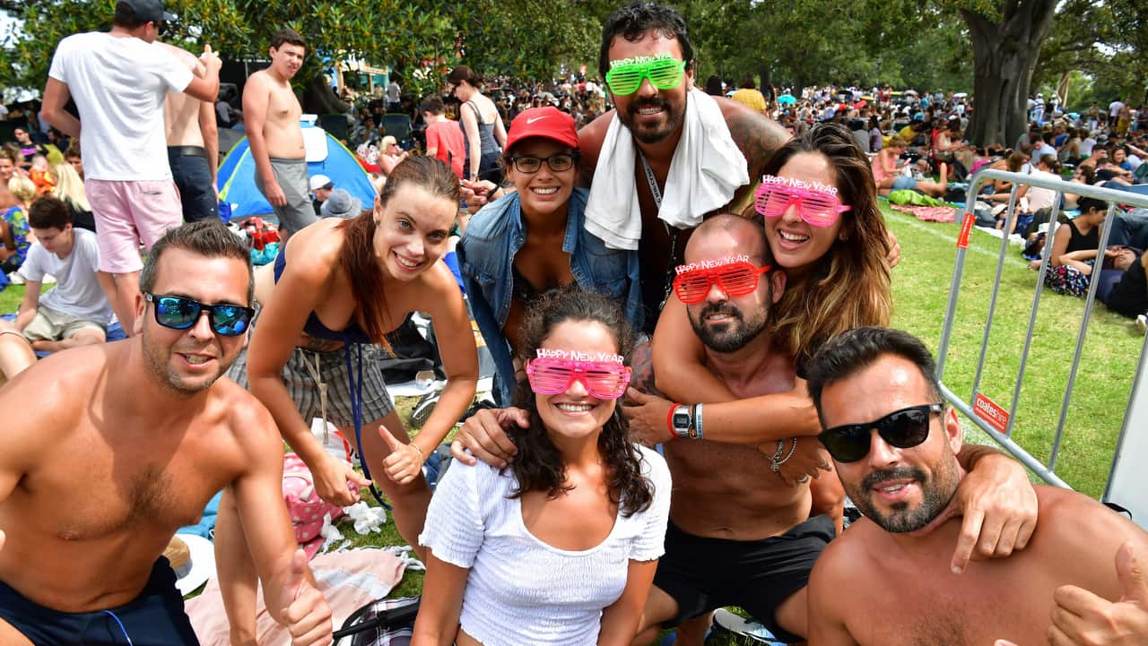 People are seen at Mrs Macquarie's Point in preparation for New Years Eve Fireworks in Sydney.