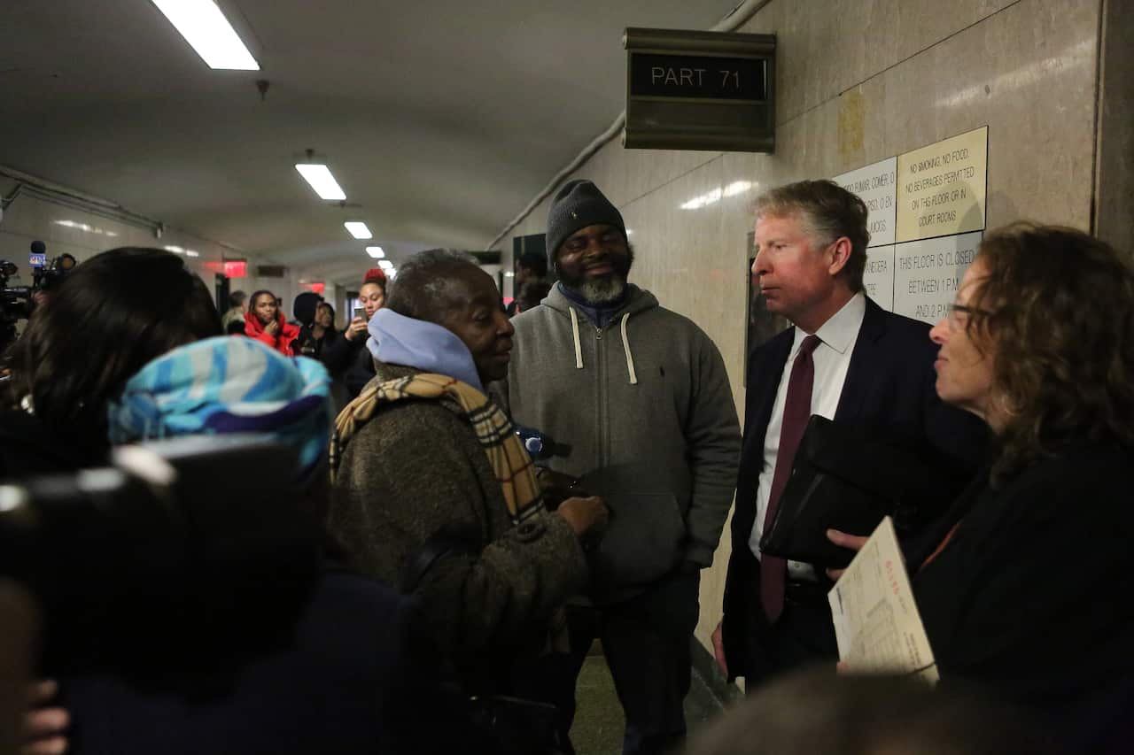 The Manhattan district attorney, Cyrus R. Vance Jr., speaks with friends and relatives of murder victim Timothy Caughman outside Manhattan Supreme Court, in New York.