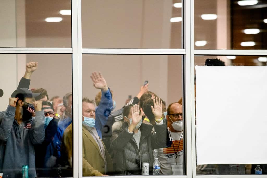 A crowd watches as workers counted absentee ballots in Detroit in November 2020.