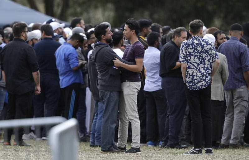 Mourners react as they carry the body of a victim of the Friday March 15 mosque shootings for a burial at the Memorial Park Cemetery in Christchurch.