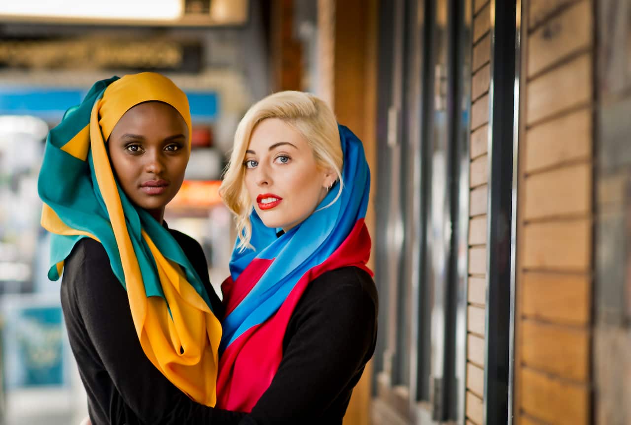 Models pose wearing MOGA headscarves