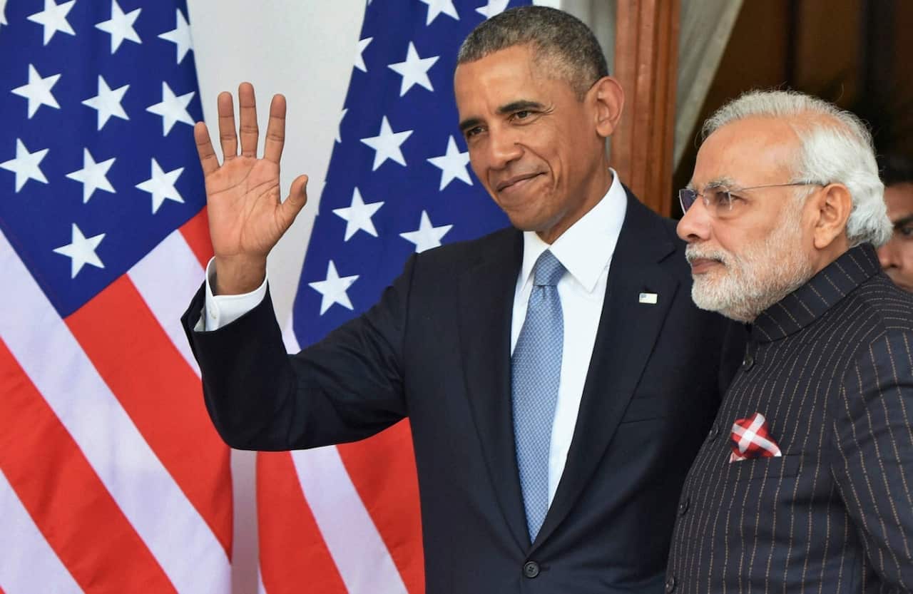 Indian Prime Minister Narendra Modi, right, in the suit, next to Barack Obama (AAP)