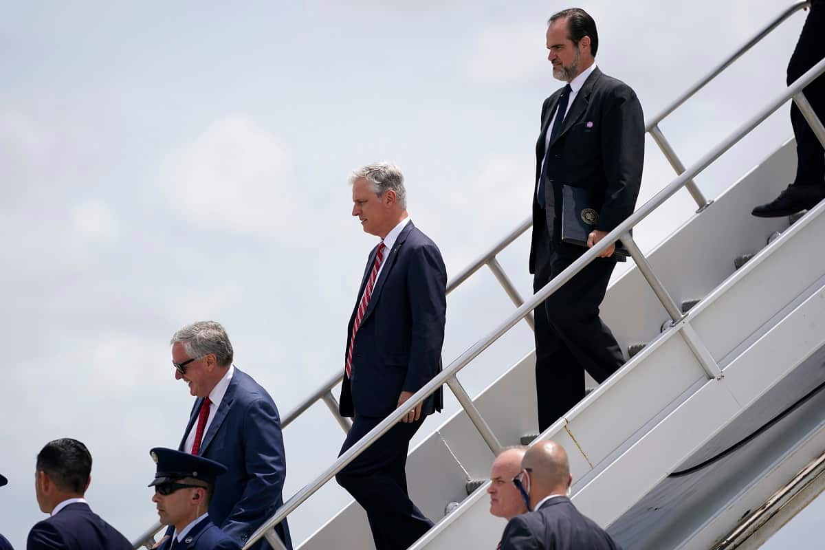 Chief of Staff Mark Meadows and White House national security adviser Robert O'Brien exit Air Force One at Miami International Airport on Friday, July 10, 2020, as they join President Donald Trump on a trip to Florida. (AP Photo/Evan Vucci)