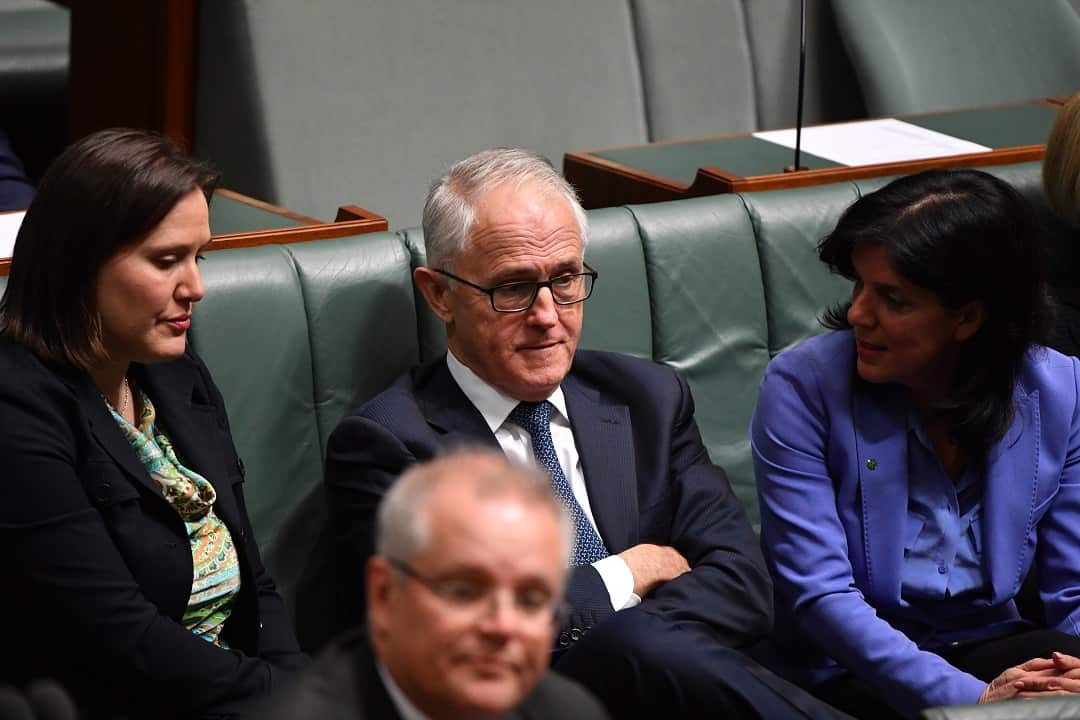 Kelly O'Dwyer (left) and Julia Banks sit either side of then prime minister Malcolm Turnbull.