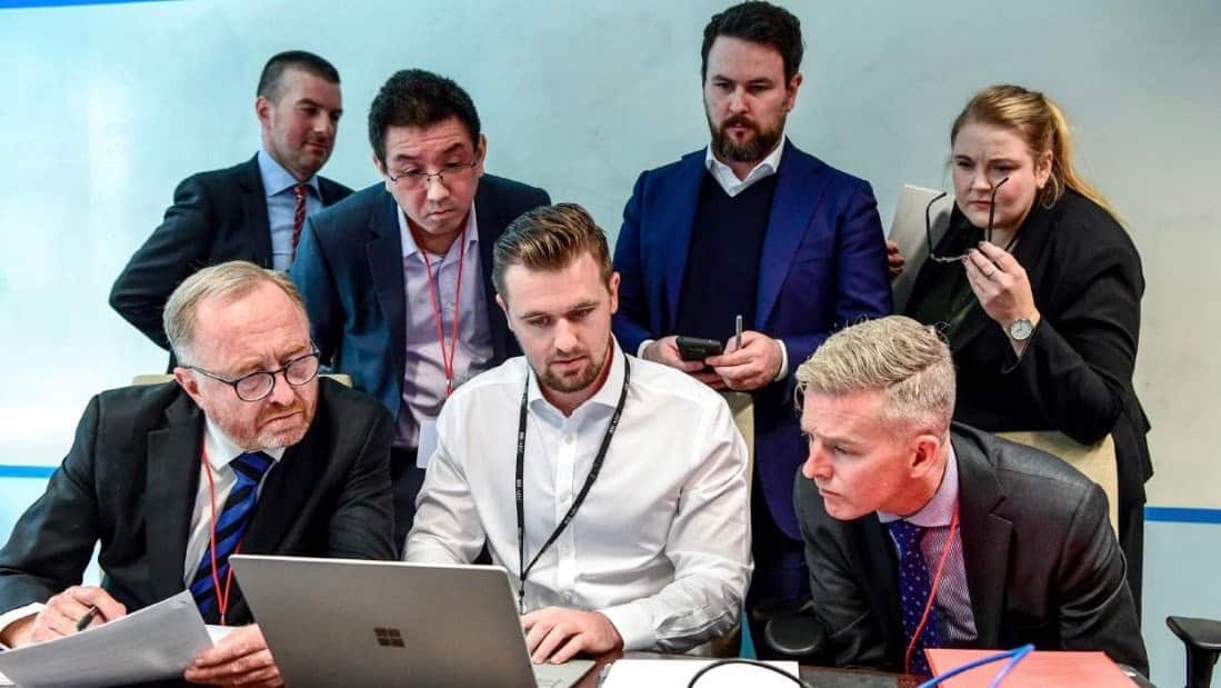 AFP officers trawl through ABC emails and files watched on by the broadcaster's lawyers. 