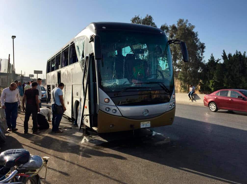 Officials inspect a bus that was damaged by a bomb, in Cairo, Egypt, Sunday, March 19, 2019 (AAP)