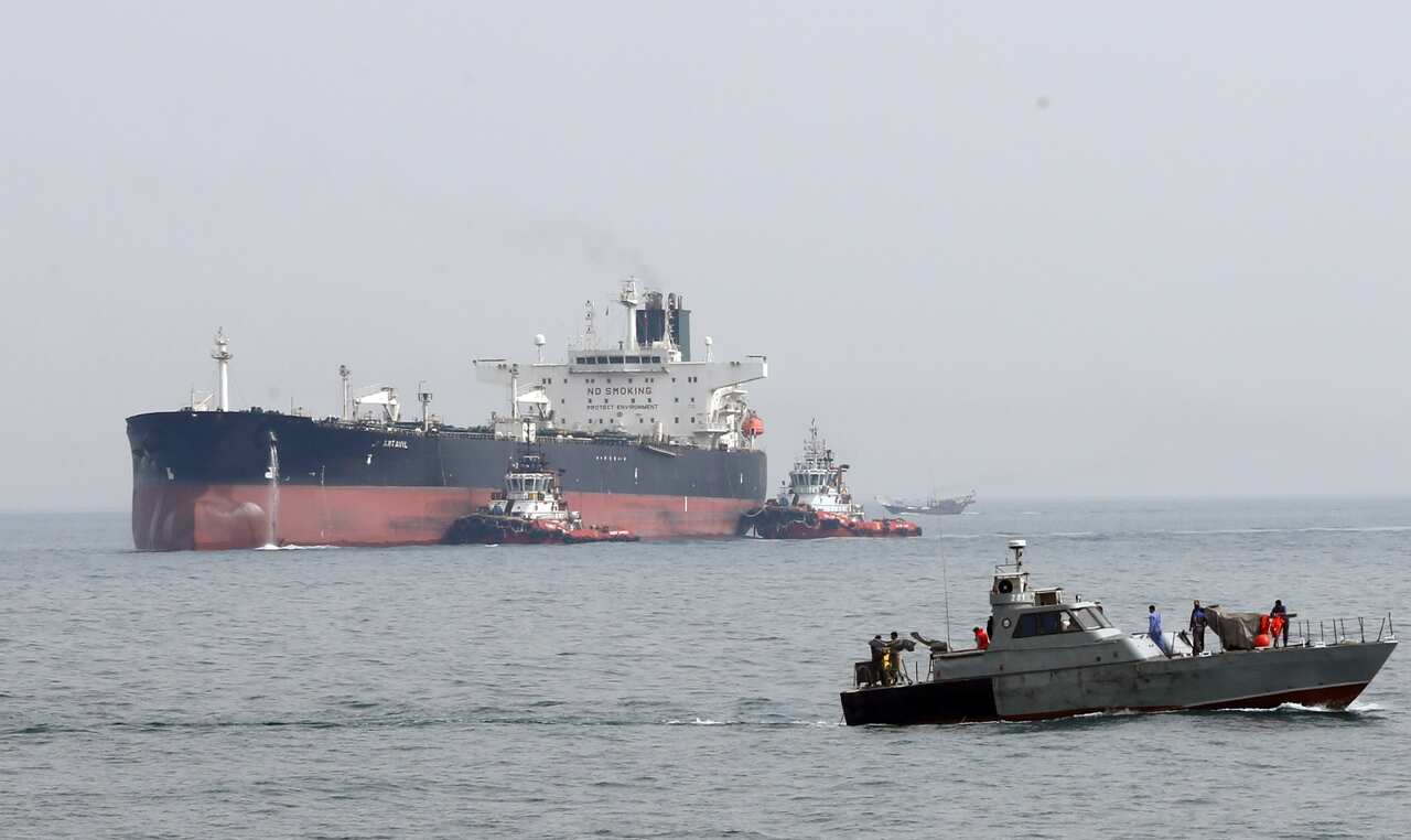 An Iranian military boat patrols next to the Artavil oil tanker, at the Kharg Island, in Persian Gulf, southern Iran, 12 March 2017 