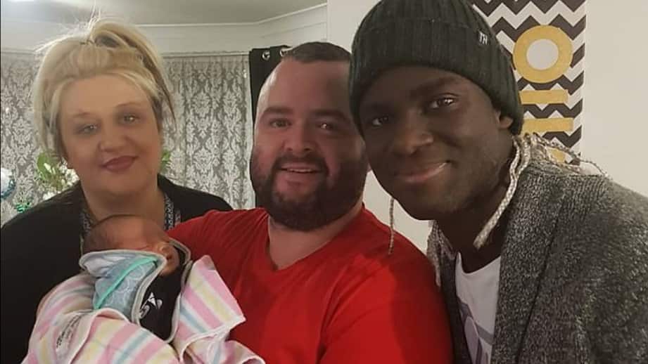 Australian Olympian Isaac Ntiamoah with his wife Angelina, baby son Josiah and friend David Yarza Porto.