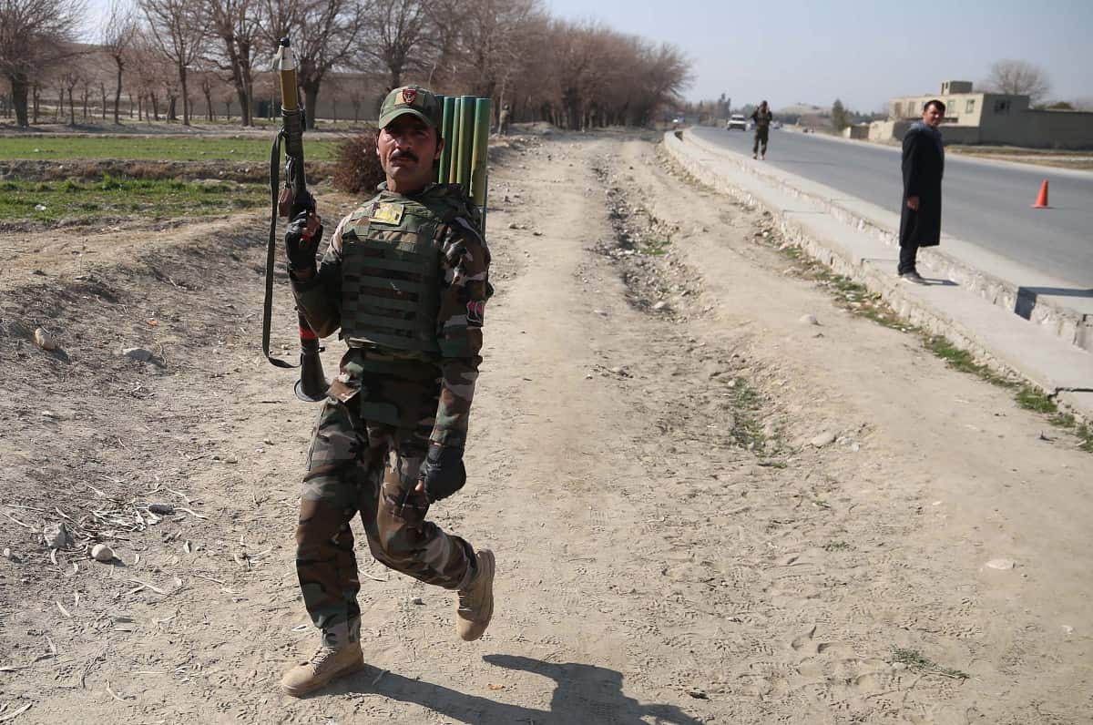 An Afghan Army soldier stands guard at a check point in Hogyani district of Nangarhar province, Afghanistan, 9 February 2020.