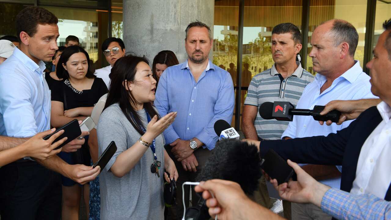 A resident asks questions of Icon Managing Director Julian Doyle at a press conference on 26/12/18.