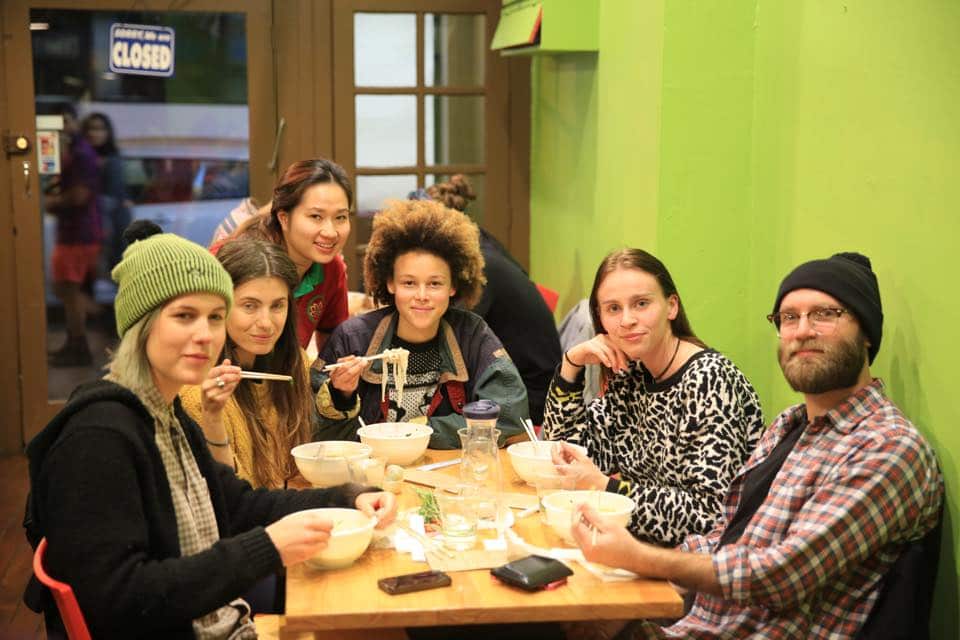 Co-owner Tracy Ho with customers during grand opening of restaurant. 