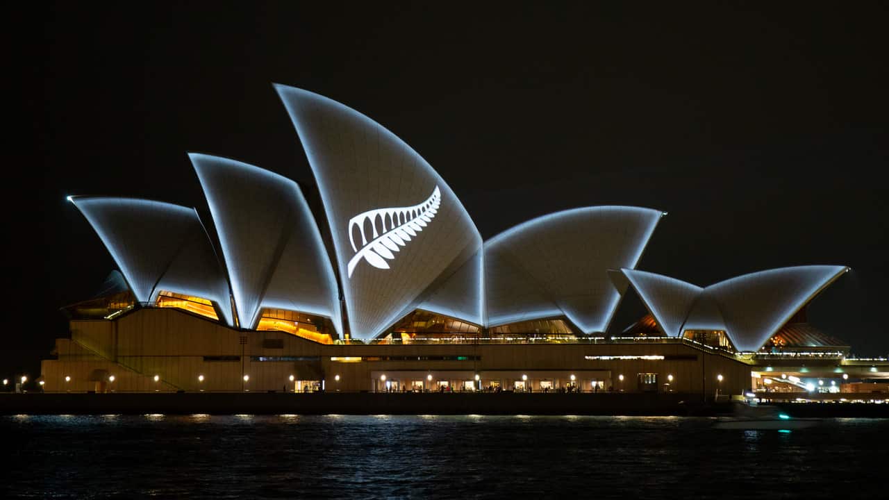 The Silver Fern of New Zealand is seen projected onto the sails of the Opera House in Sydney.