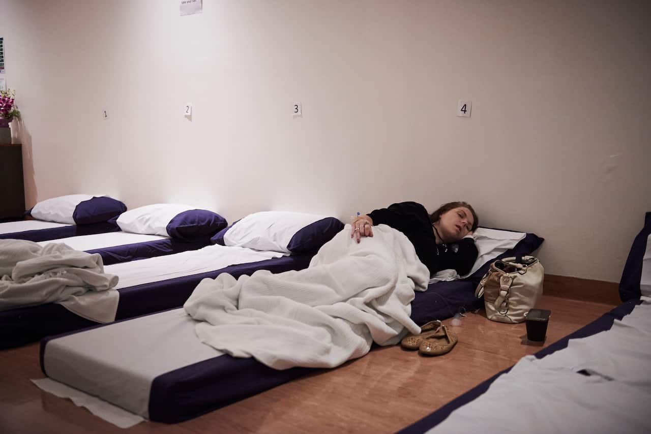 Ms. Martin in the recovery room after her naltrexone implant. The treatment costs about 7,000 Australian dollars, or about $4,800USD, for local patients.