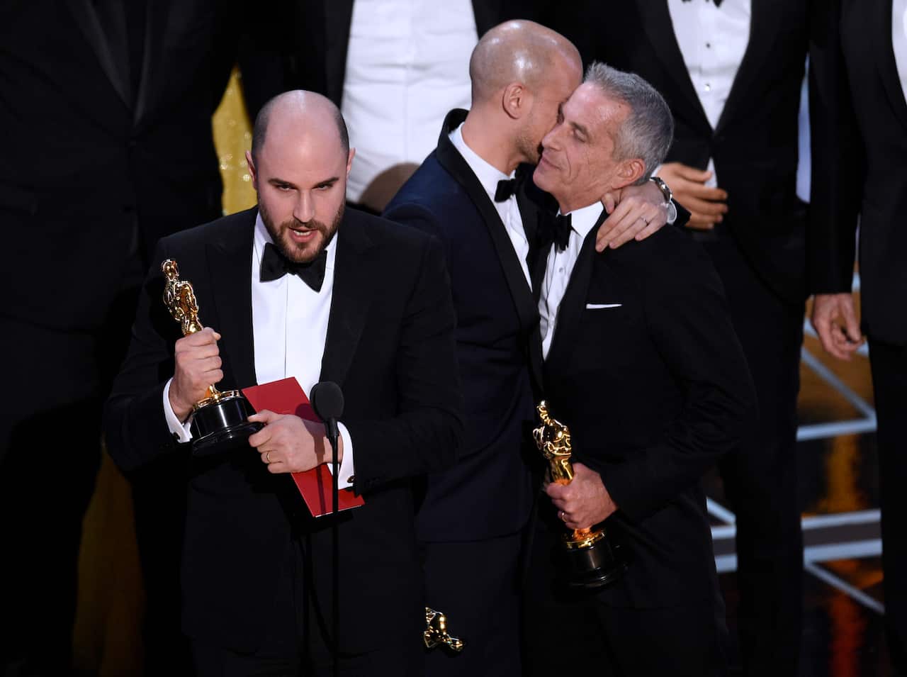 Jordan Horowitz, left, of "La La Land," mistakenly accepts the award for best picture at the Oscars.