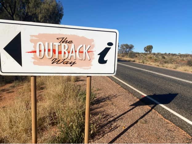 Road sign telling tourists when they’re driving on part of the Outback Way road network.