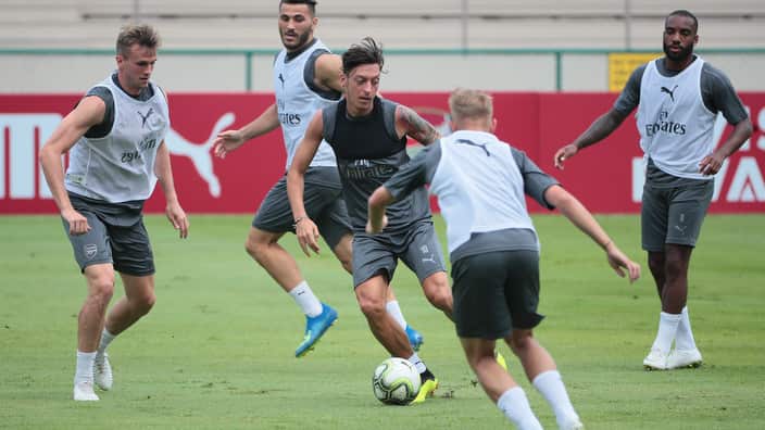 Mesut Ozil (centre) during a training session at the Singapore American School.