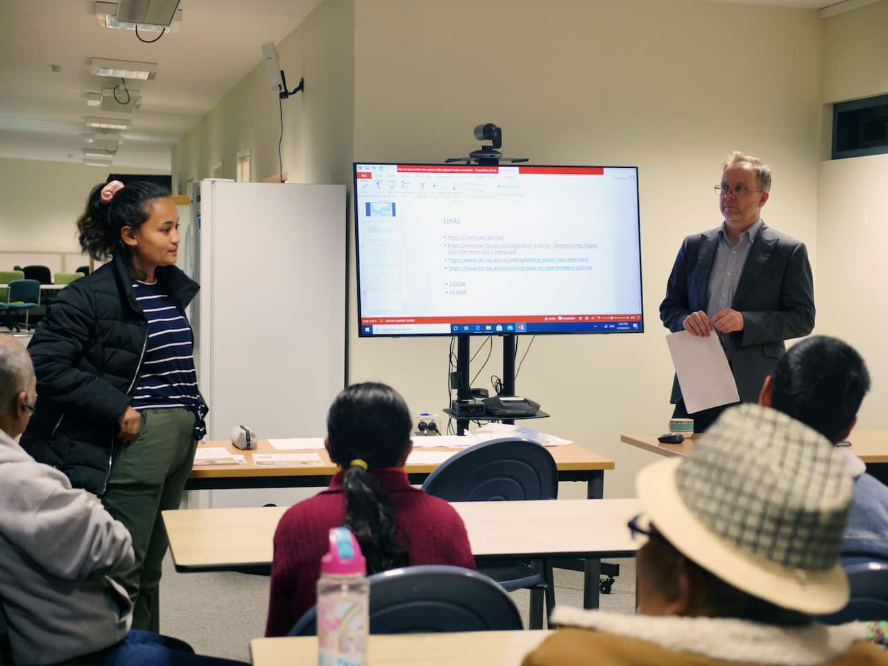 People attending the "how to vote" session at the Migrant Resource Centre on Tuesday night.