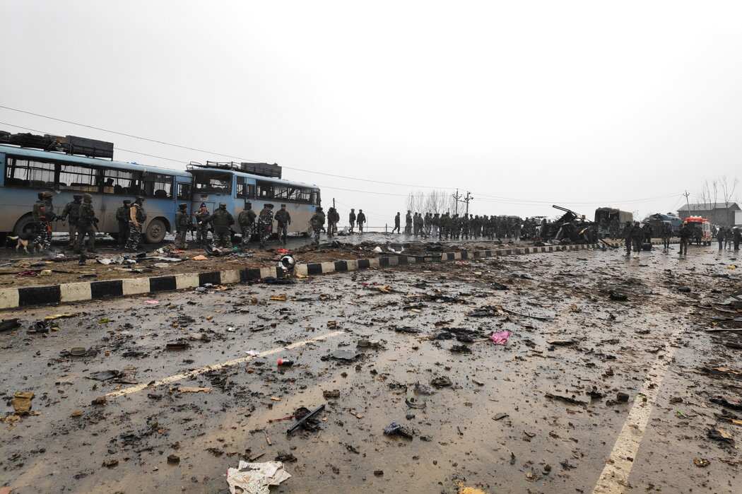 Indian soldiers examine debris after an explosion in Pulwama, in southern Kashmir.
