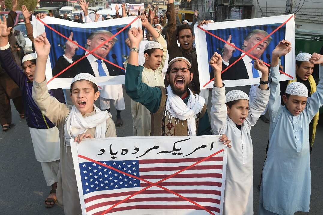 Pakistani demonstrators take part in a protest against US aid cuts in Lahore.