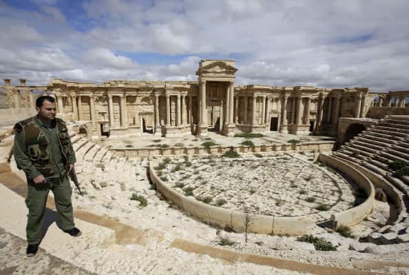 Syrian policeman patrolling the ancient city in March, before IS siezed control (AFP/Getty Images)
