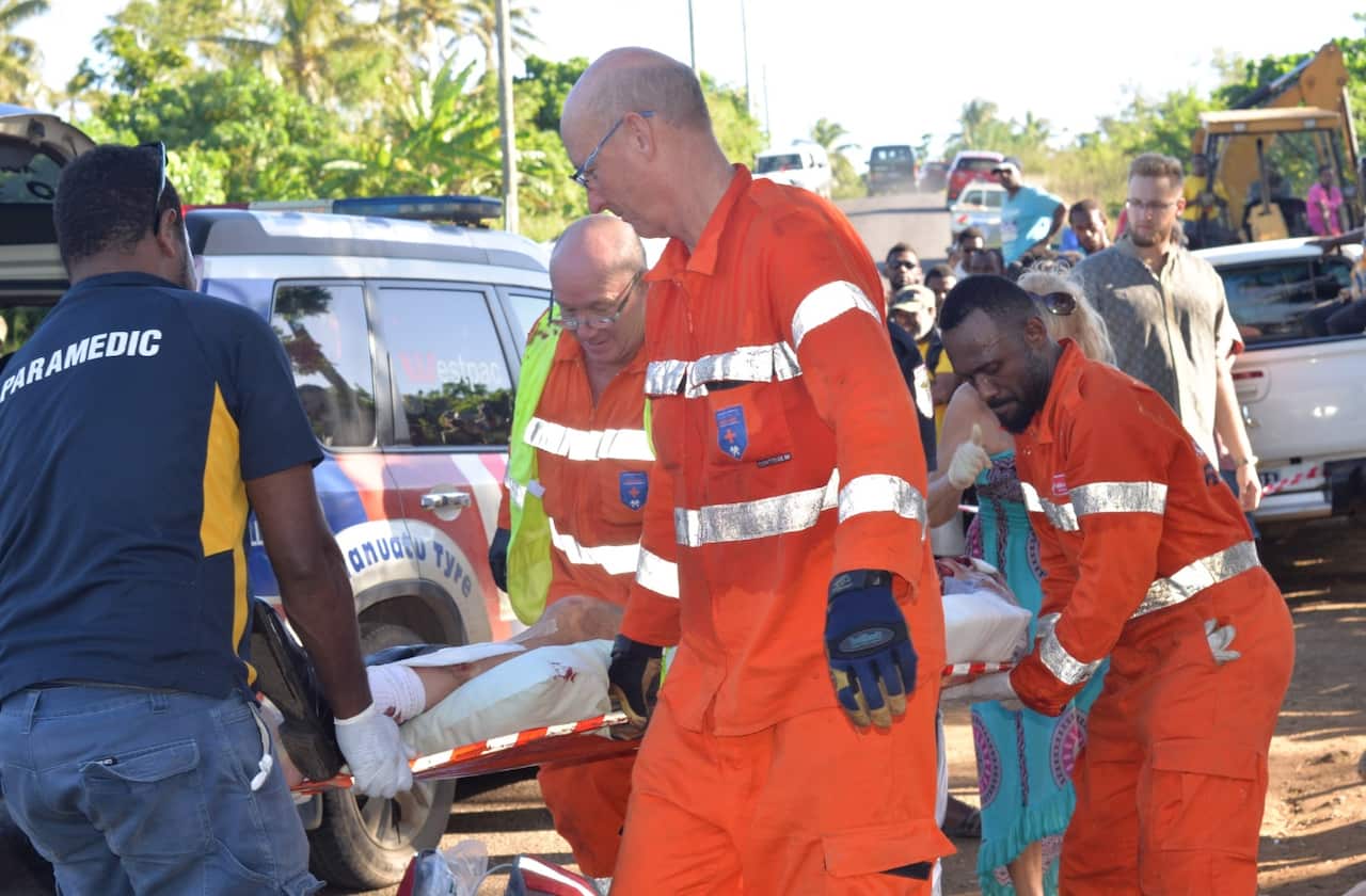 Emergency staff tend to the injured after the bus crash in Vanuatu's capital of Port Vila.