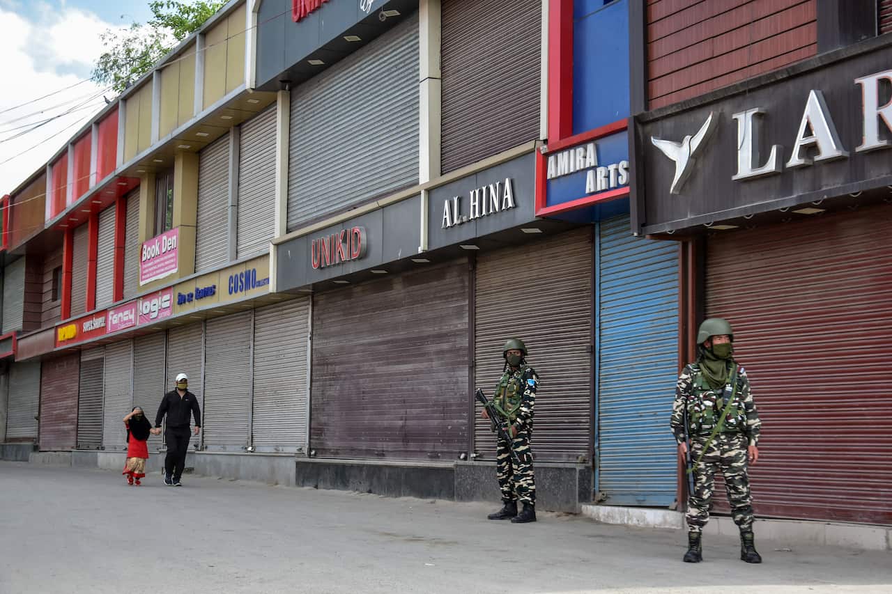 Paramilitary troopers stand on guard in Kashmir (AAP)