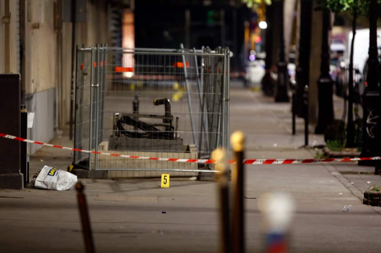 An evidence is seen at the site of a knife attack in Paris, Monday, Sept. 10, 2018.