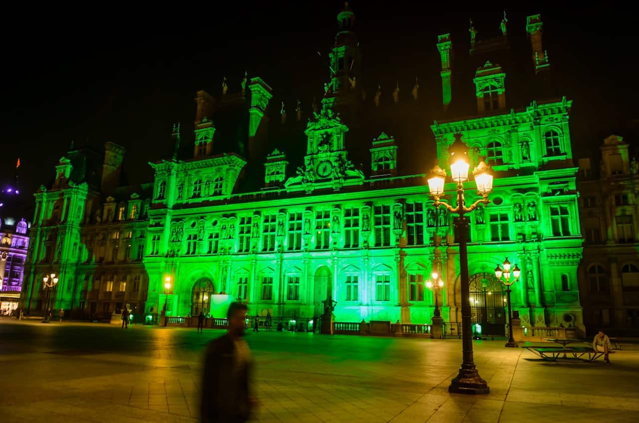 The Paris City Hall is illuminated in green to mark the disapproval of the French capital and its mayor Anne Hidalgo (AAP)