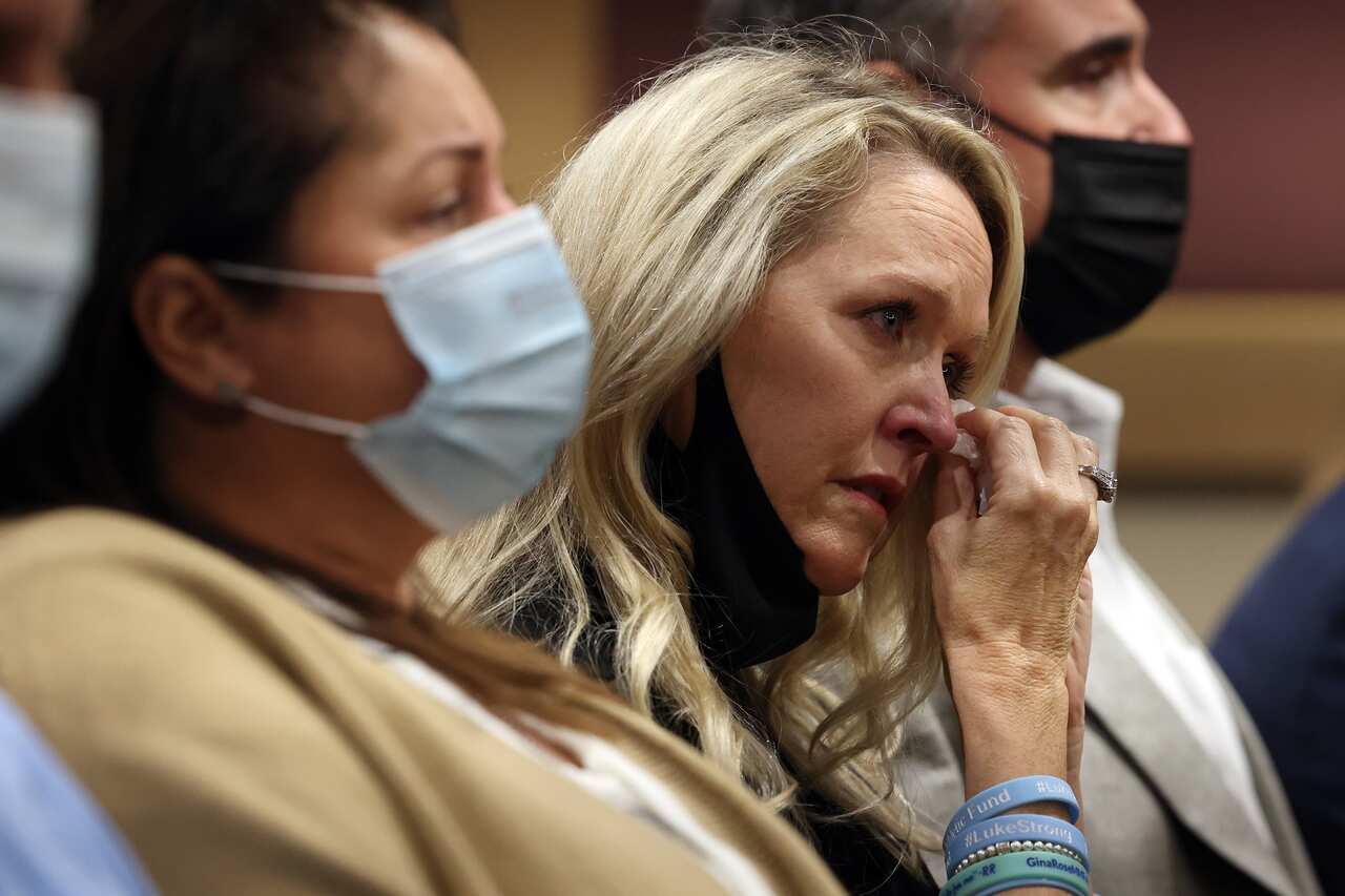 Gena Hoyer wipes away tears as her son's name is read aloud during high school shooter Nikolas Cruz's guilty plea at the Broward County Courthouse in Florida.