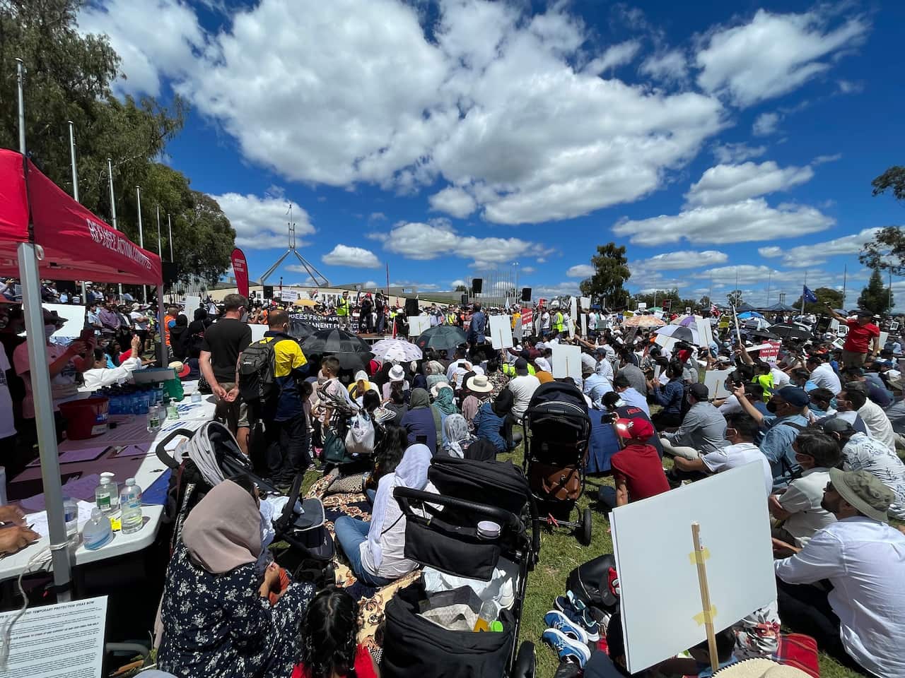 Large number of protesters from Afghanistan calling for permanent pathways to resettling in Australia. 