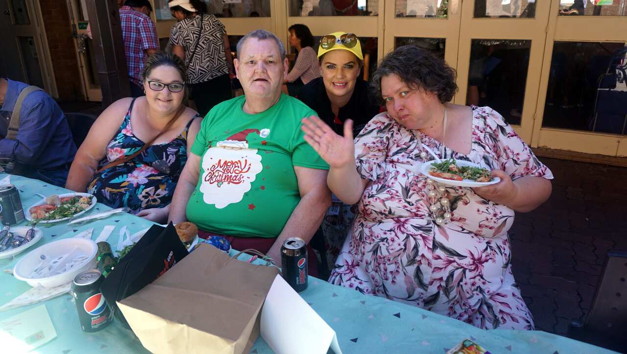 Locals enjoy the Christmas spread. 