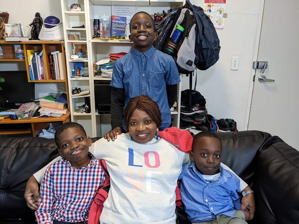 Pascasie with her three sons.