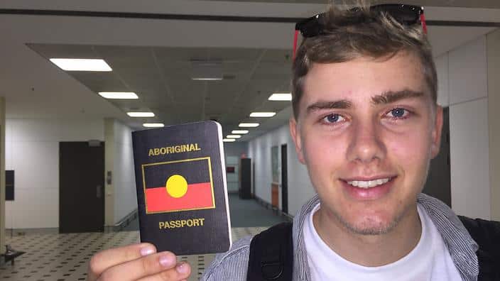Callum Clayton-Dixon and his Aboriginal passport with Solomon Islands entry and exit stamps.