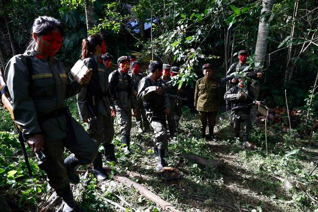 Fighters of the New People's Army prepare for formation