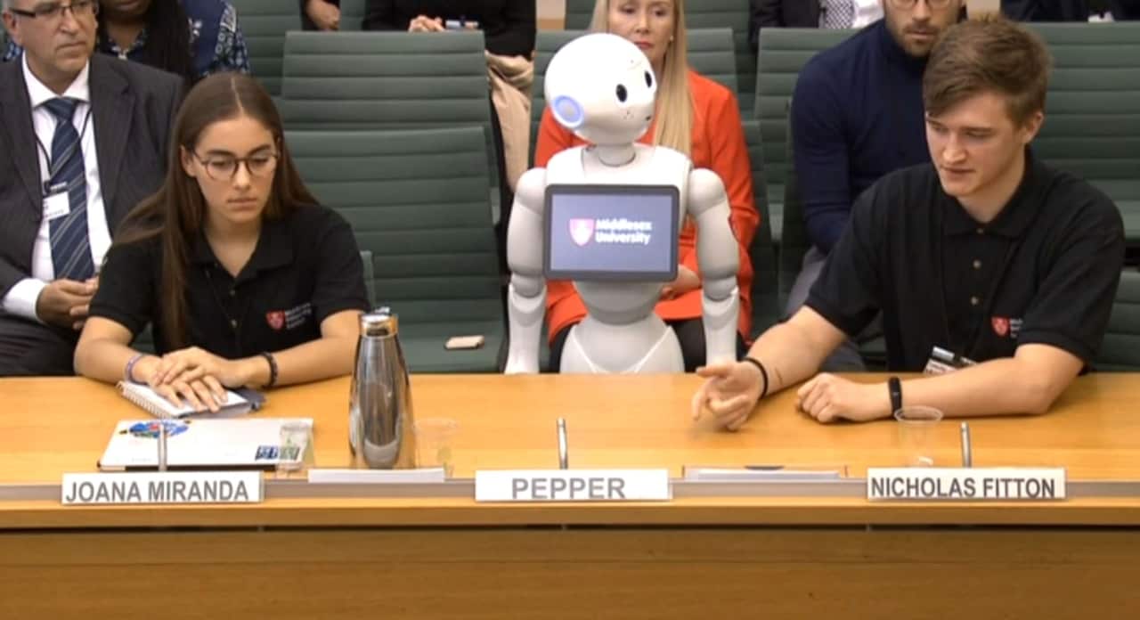 Video still of Pepper the robot, appearing before a select committee for the first time, to answer questions about the fourth industrial revolution