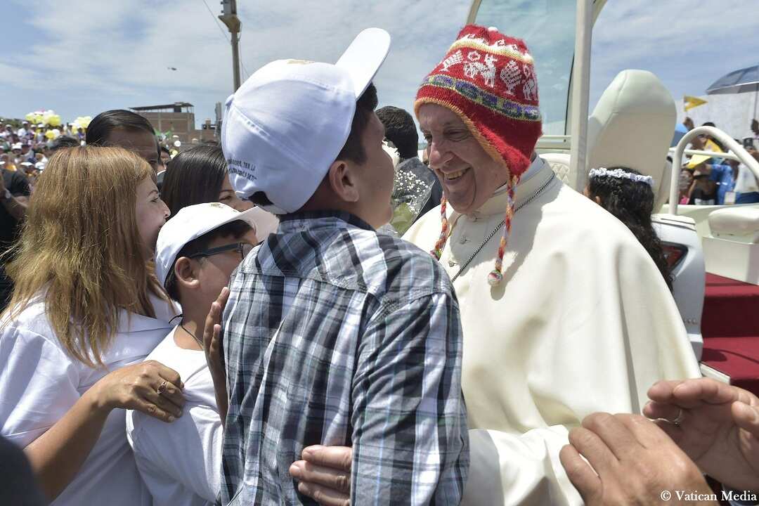 Pope Francis wears a woollen hat traditionally worn by Peru's Indigenous peoples.