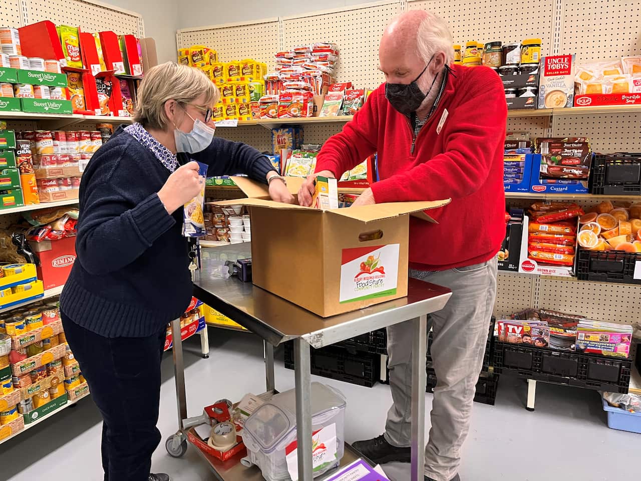 Peter Matthews packs a hamper at FoodShare