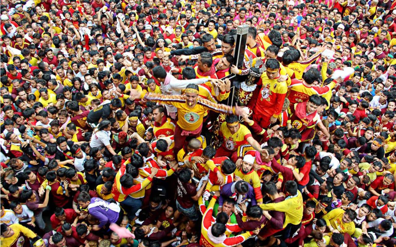 Devotees trying to touch the icon of Black Nazarene and the rope as their belief that it may granted their wish or part of their Panata or devotions. 