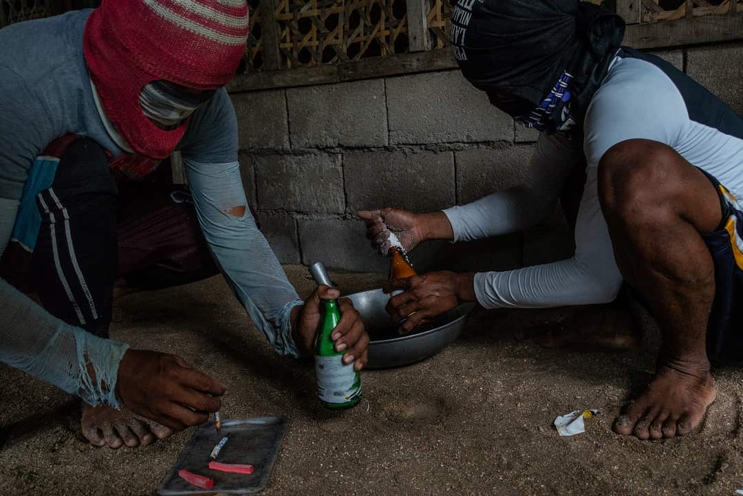 Preparing the homemade bombs used for illegal fishing. Dynamite fishing destroys both the food chain and the corals where the fish nest and grow.