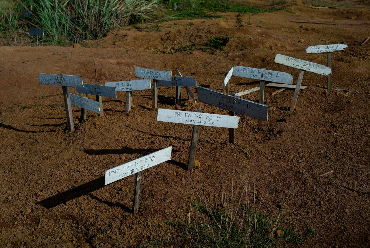 Wooden labels serving as markers of a mass grave of recovered bodies from inside the citys area of conflict with the Islamic State group, in Marawi City, the Philippines.