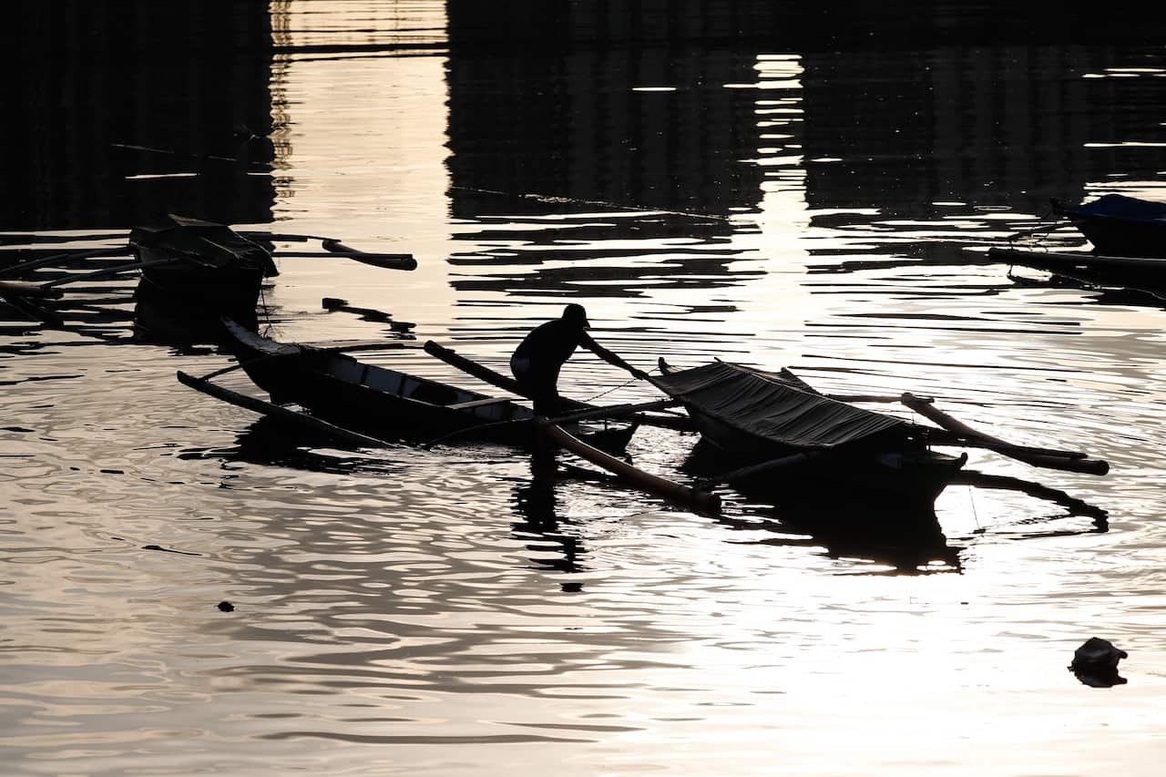 A fisherman secures a boat in preparation for typhoon Goni in Manila, Philippines, 31 October 2020. 