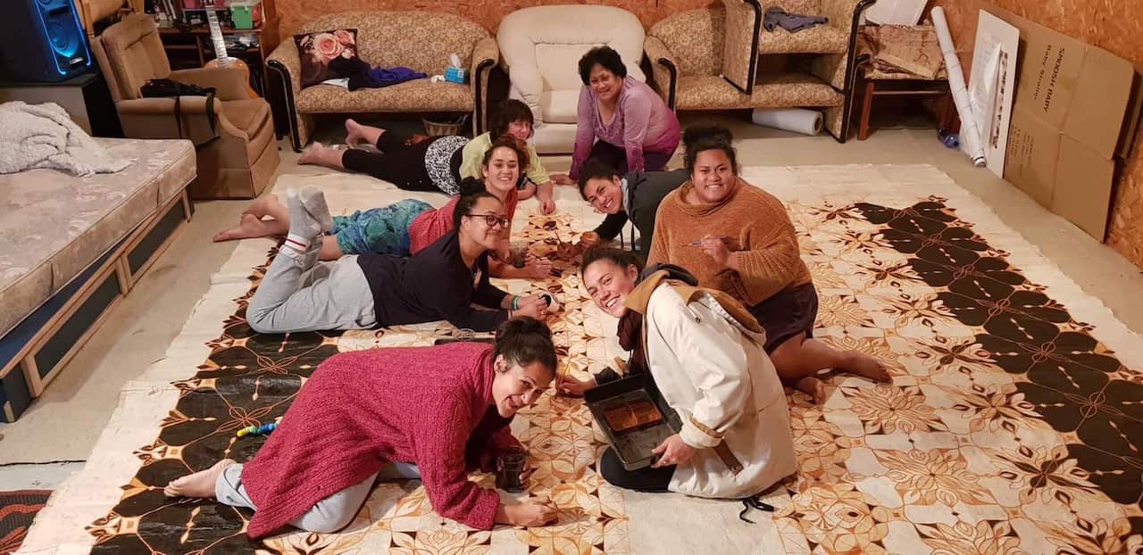 Ruha Fifita and her siblings and friends creating the family heirloom.