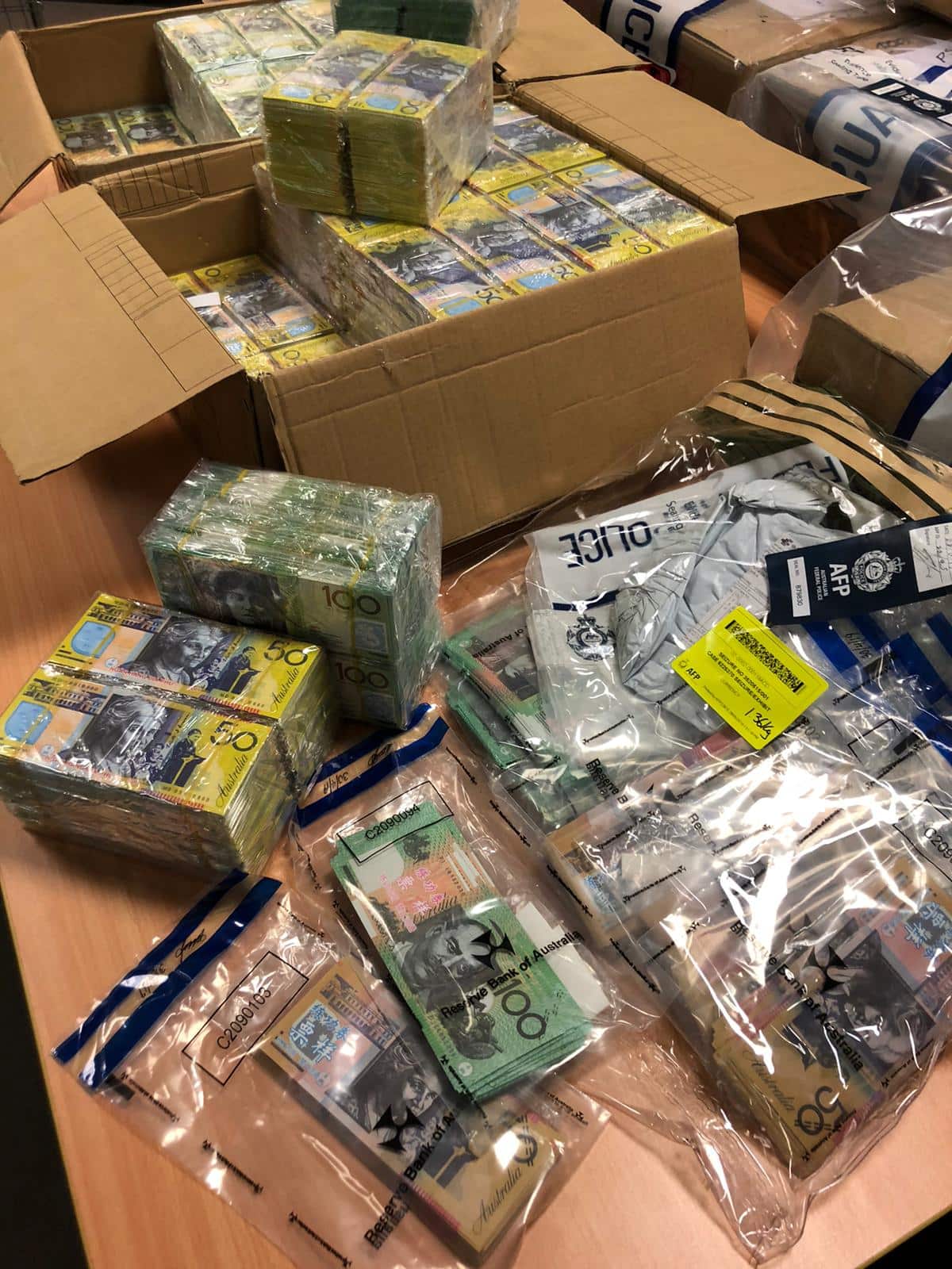 Bundles of fake $100 and $50 notes have been seized by federal police.