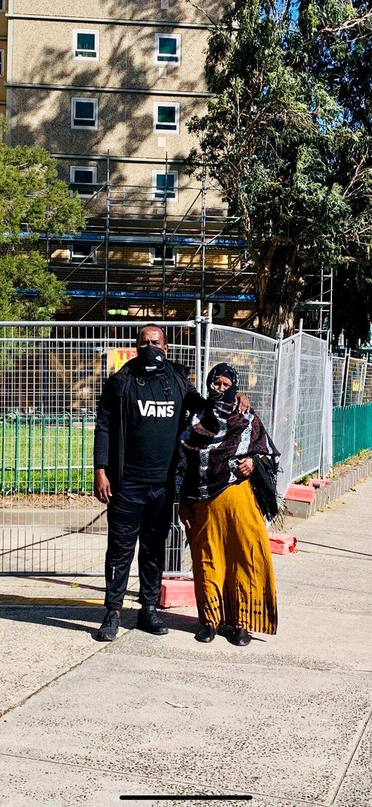 Abdullahi Ahmed and his 89-year old mother, Hawa outside their apartment building in Flemington, Melbourne
