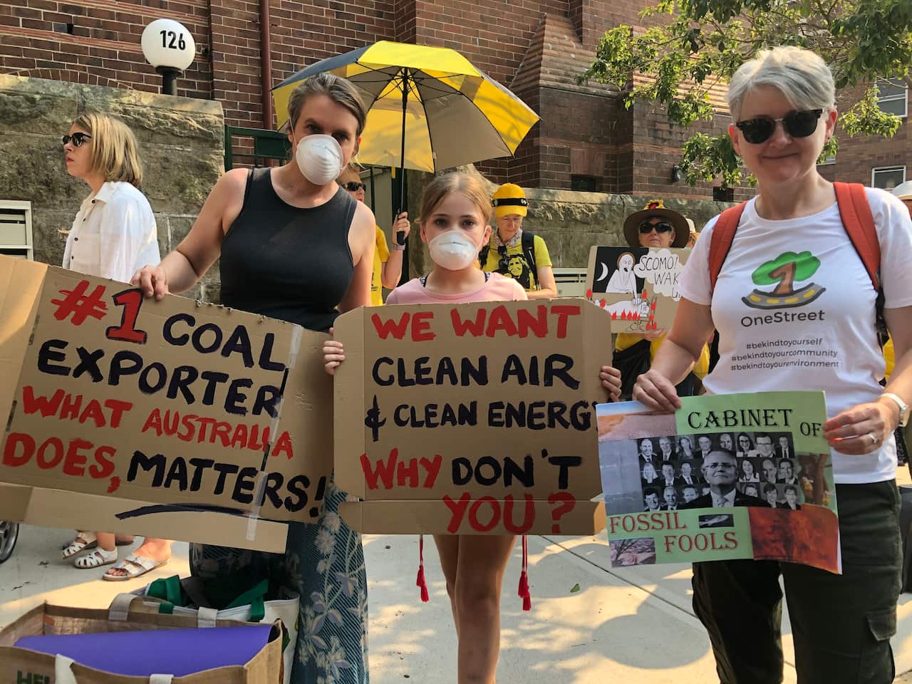 Protesters gather outside Kirribilli House to demand environmental policy leadership from Scott Morrison.