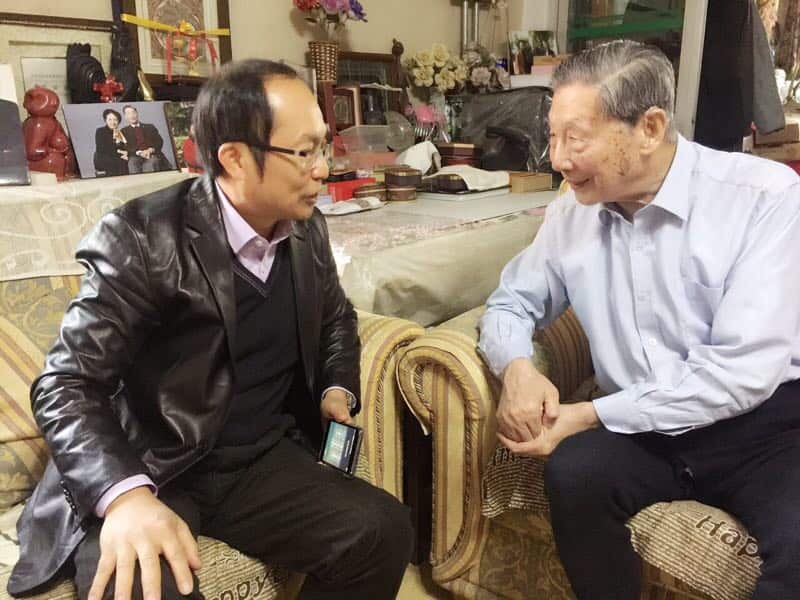 Dr Chongyi Feng in Beijing shortly before his arrest, pictured here with a high-profile legal expert.