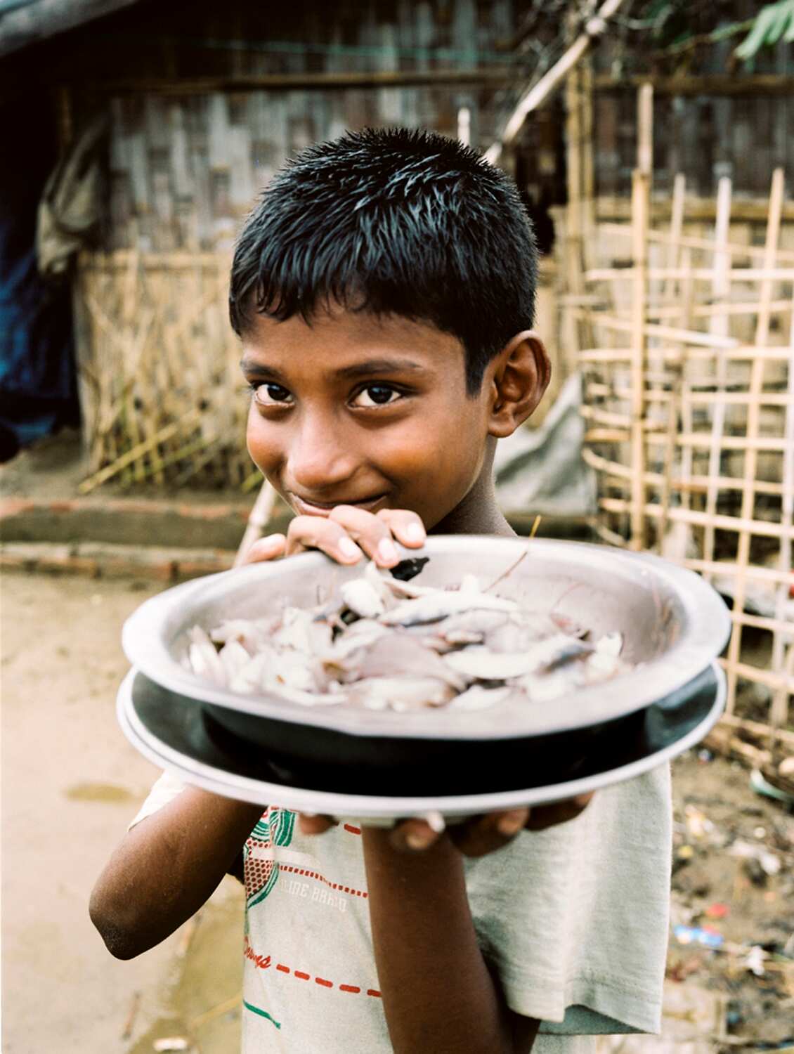 A young Rohingya boy posing for photographer Ali MC.