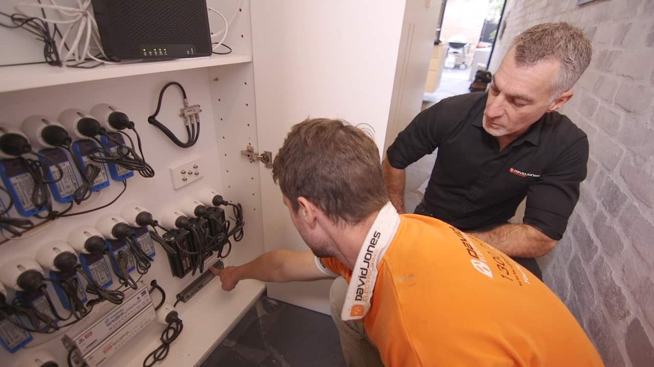 Electrician David Jones working with employees